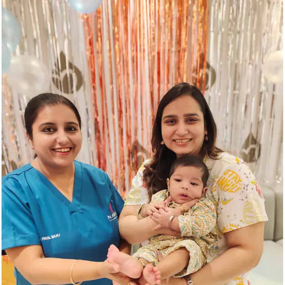 Happy family with newborn miracle baby conceived through IVF at Nandi IVF - Photo 7